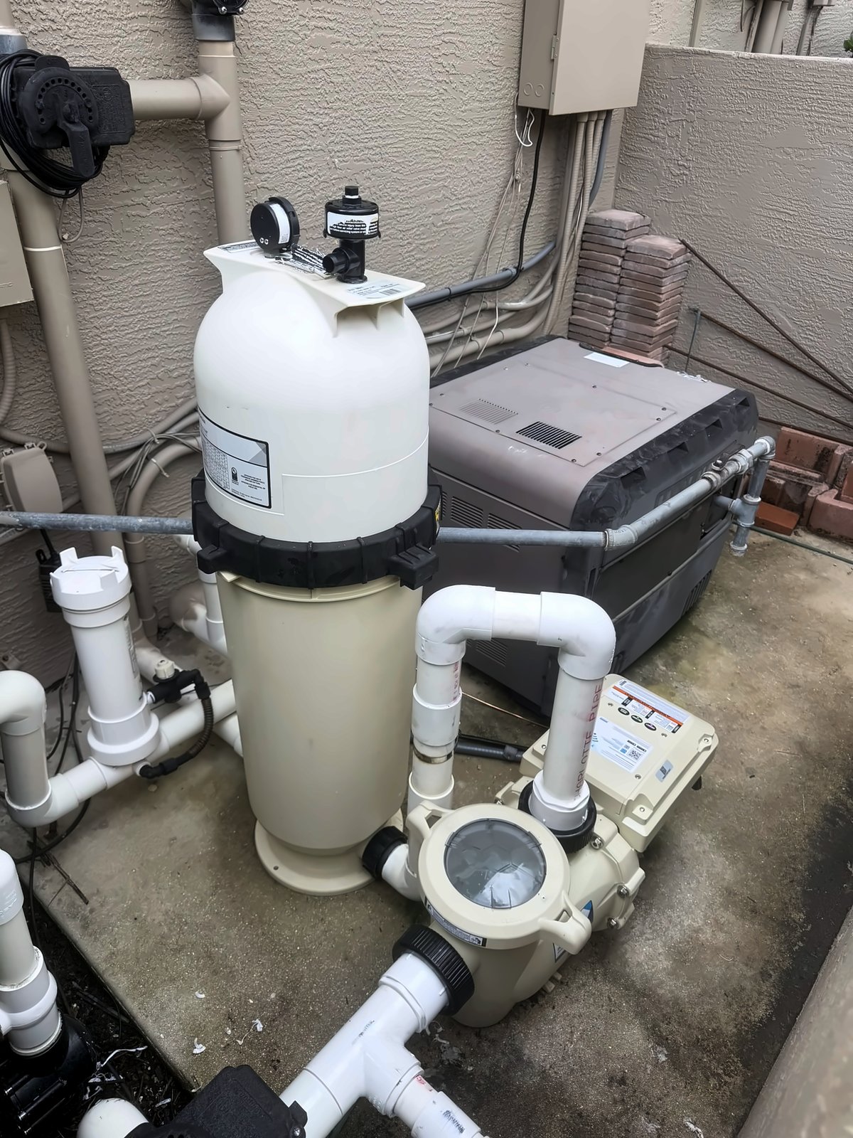 Pentair variable-speed pool pump and filter installed on a pool equipment pad